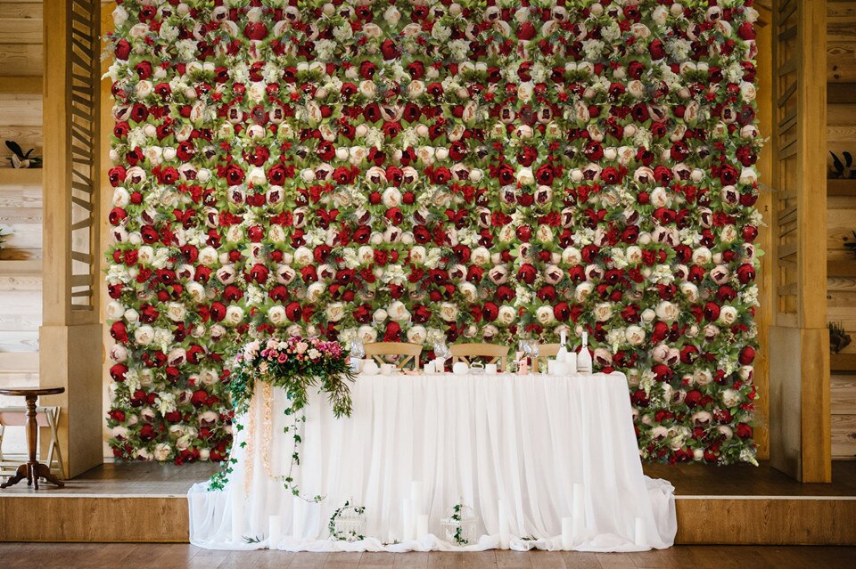 Floral Arrangements: Creating stunning flower displays for the wedding arch.